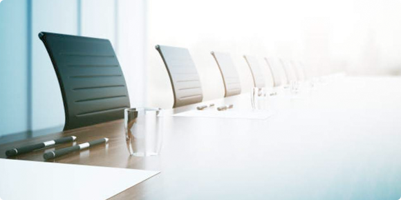 Board room with empty chairs