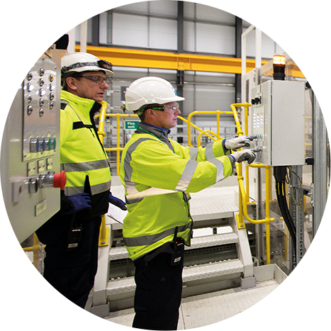 Two people looking at controls